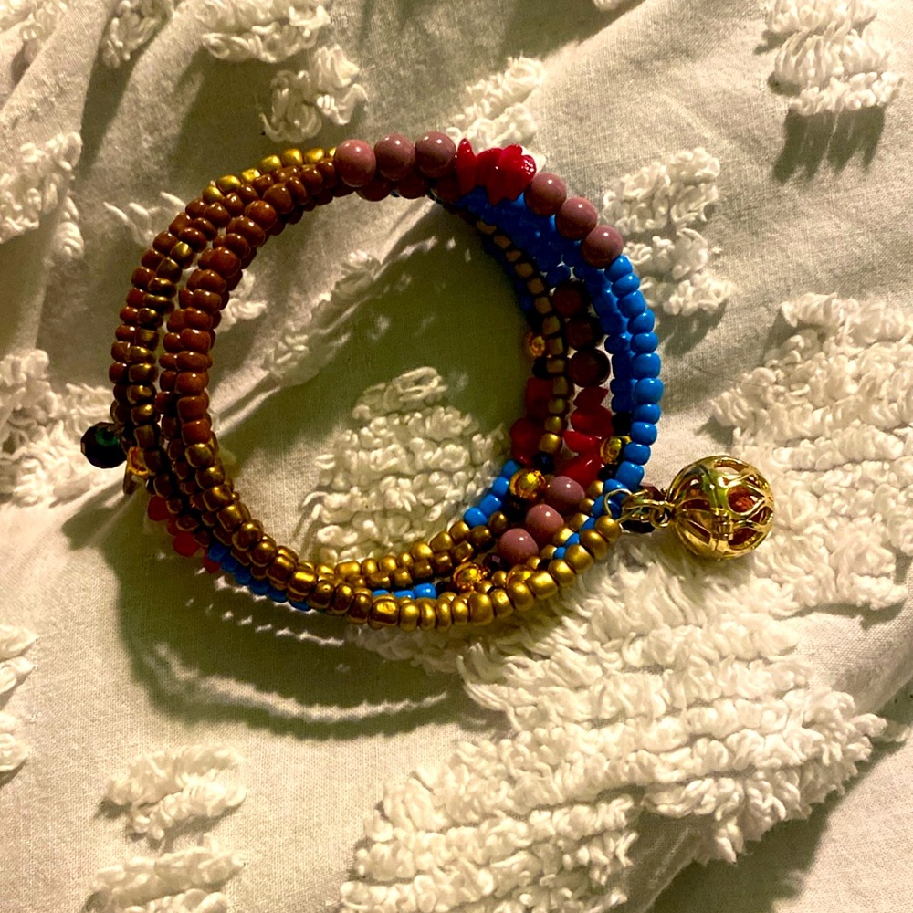 I am selling a bracelet, it’s multi colored with a dangling ball and beads